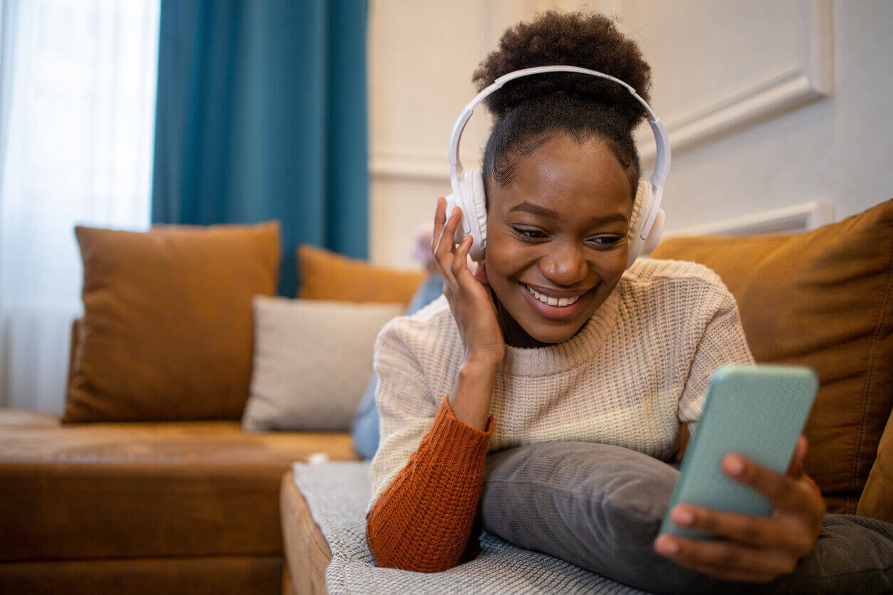 Portrait of an excited woman enjoying music