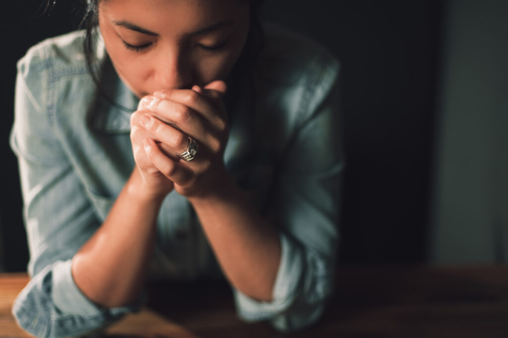 A woman in prayer